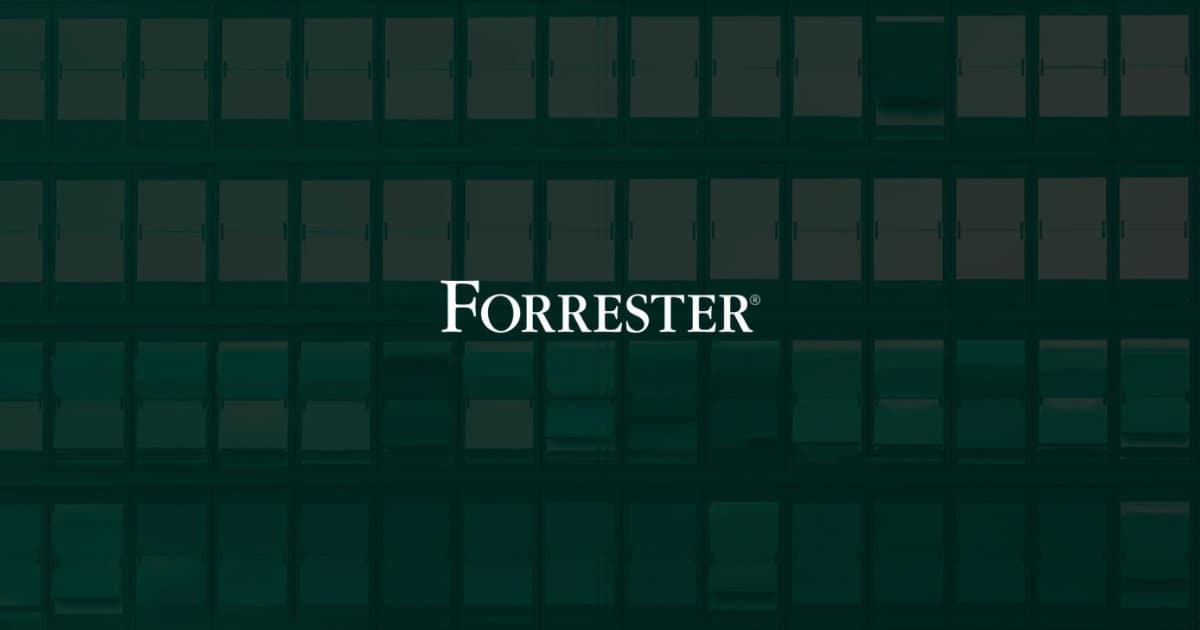 White Forrester logo centered on a dark, blurred background featuring the outlines of windows on a building.