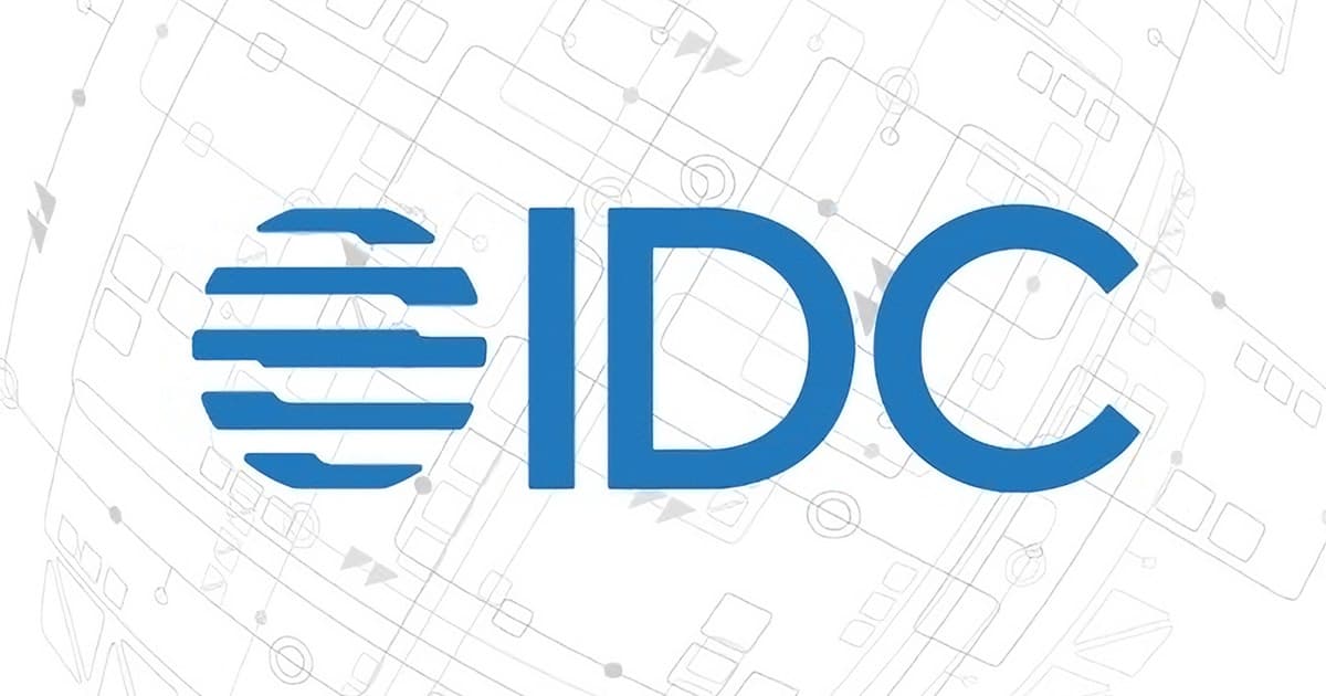 Blue IDC logo with three horizontal blue lines forming a circular shape to the left of the letters IDC, set against a light gray background with faint, abstract geometric patterns.