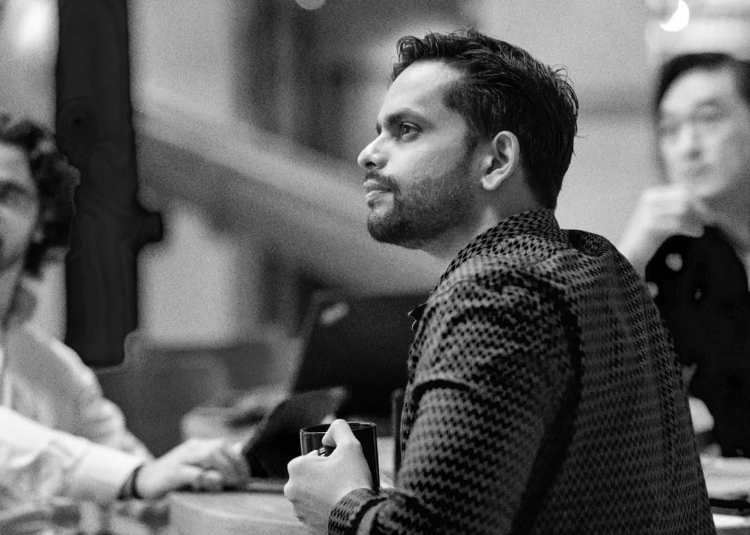 A man holding a cup.